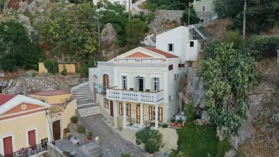 an aerial view of a house on a mountain at Hermes Traditional house in Gialos in Symi