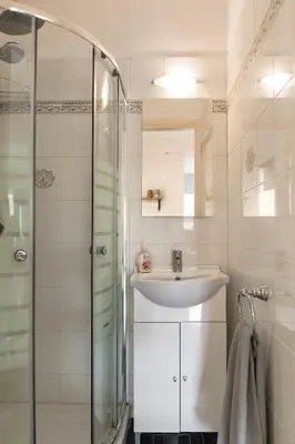 a bathroom with a sink and a shower at Russelia Suite right in the heart of Rhodes City in Rhodes Town