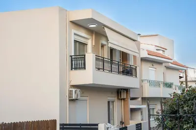 a building with balconies on the side of it at Golden Grove in Afantou