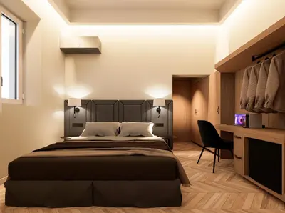 a bedroom with a large bed and a desk at Essence 55 Living in Rhodes Town