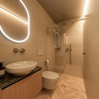 a bathroom with a toilet and a sink and a shower at Essence 55 Living in Rhodes Town