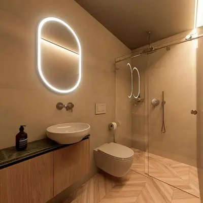 a bathroom with a toilet and a sink and a mirror at Essence 55 Living in Rhodes Town