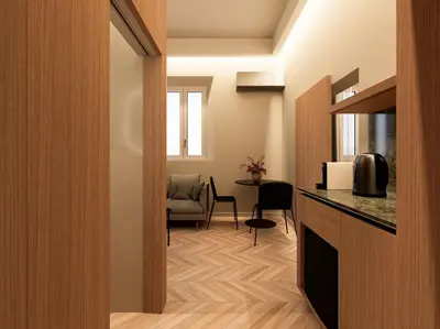 a room with a kitchen and a living room with a table at Essence 55 Living in Rhodes Town