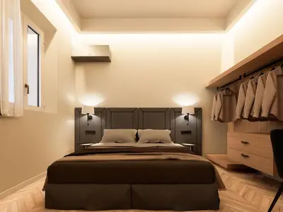 a bedroom with a large black bed and a dresser at Essence 55 Living in Rhodes Town