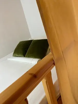 a green pillow sitting on top of a ladder at Traditional Stay in Archangelos