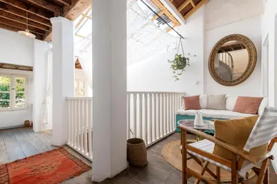 a living room with a couch and a table at Maison Amandine in Rhodes Town