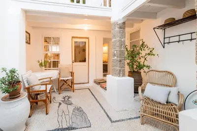 a living room with chairs and a table at Maison Amandine in Rhodes Town