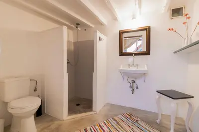 a bathroom with a toilet and a sink at Maison Amandine in Rhodes Town