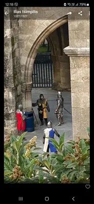 a group of people dressed in costumes standing in an archway at boutique hotel FASHI NIK in Rhodes Town