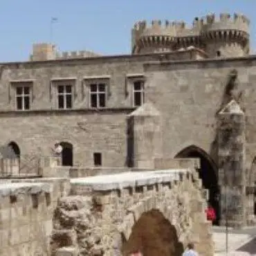 an old castle with a bridge in front of it at boutique hotel FASHI NIK in Rhodes Town