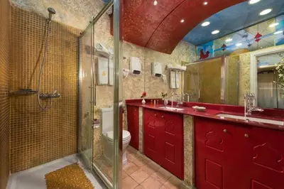 a bathroom with a shower and a sink and a toilet at boutique hotel FASHI NIK in Rhodes Town