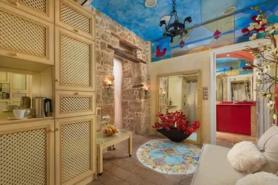 a living room with aamed ceilings and a room with a table at boutique hotel FASHI NIK in Rhodes Town