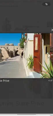 a screenshot of a picture of a street and a bridge at boutique hotel FASHI NIK in Rhodes Town