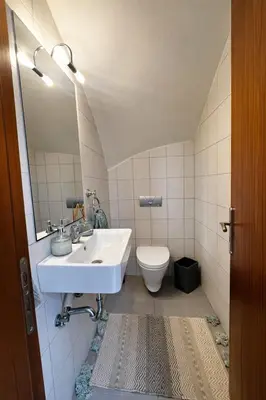 a bathroom with a sink and a toilet at Casa Verde Pastida in Pastida