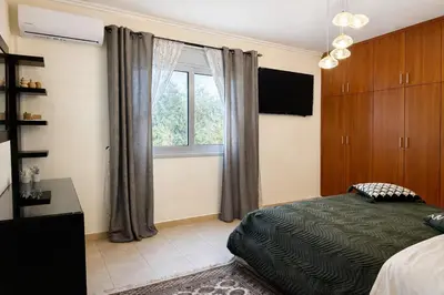 a bedroom with a bed and a window at Casa Verde Pastida in Pastida