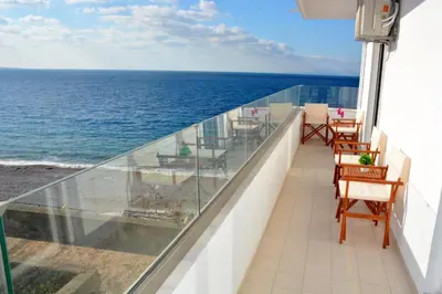 a balcony with a view of the ocean at Diogenis seaside apartment in Rhodes Town