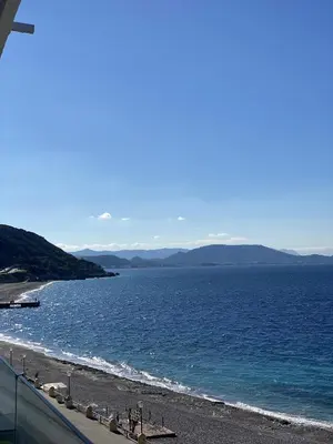 a view of a beach and the ocean at Diogenis seaside apartment in Rhodes Town