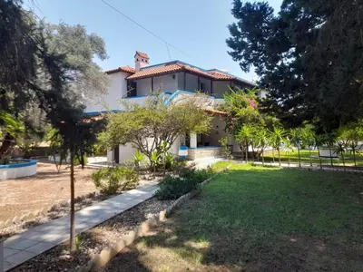 a house with a garden in front of it at Diotima Rhodos Experience in Rhodes Town