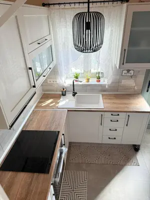 a small kitchen with a sink and a window at Spitaki in Kremasti