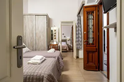 a bedroom with two beds with towels on them at Villa Yannis in Líndos