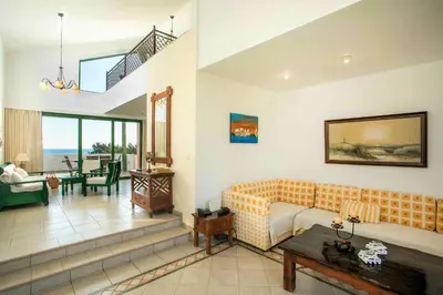 a living room with a couch and a table at Beachfront Villa Rhodes SeaShell in Gennadi
