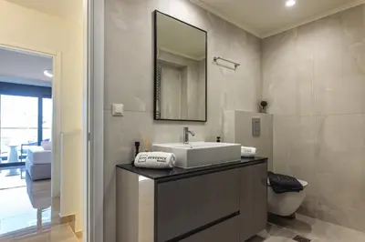 a bathroom with a sink and a mirror at Unique Icon Residence in Rhodes Town
