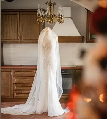 a wedding dress is hanging in a kitchen at Fournos Traditional Luxury Villa - Stegna Rhodes in Vrachonisída touArchangélou