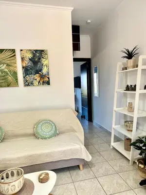 a living room with a bed and shelves at Andreana s View House Rhodes in Asgourou