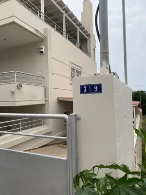 a sign on the side of a building at Andreana s View House Rhodes in Asgourou