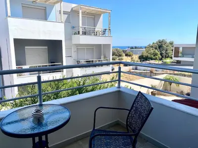 a table and chairs on a balcony with a view at Andreana s View House Rhodes in Asgourou