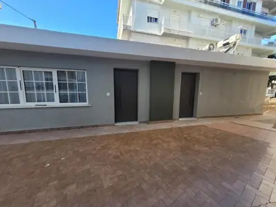 a house with two doors and a building at Hyacinthus city apartment in Rhodes Town
