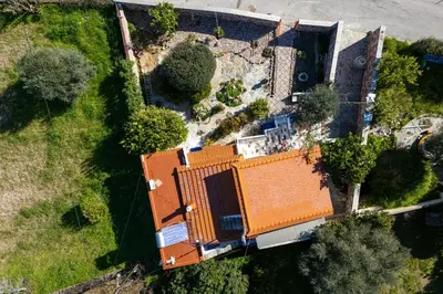 an overhead view of a house with an orange roof at Aelia Filoxenia Cottage in Afantou