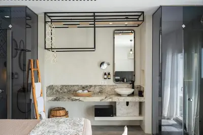 a bathroom with a sink and a mirror at K Studios in Faliraki