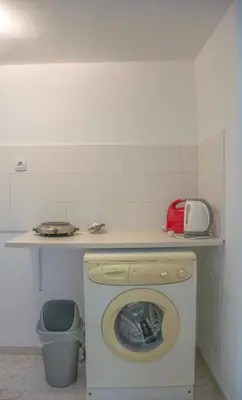 a washing machine in a kitchen with a counter at Palm Residence l - Islander's Home Collection in Rhodes Town