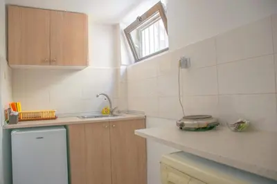 a small kitchen with a sink and a counter at Palm Residence l - Islander's Home Collection in Rhodes Town