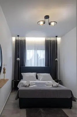a bedroom with a large bed in front of a window at maison de rivière in Afantou