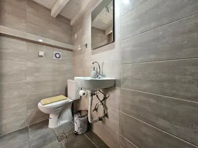 a bathroom with a sink and a toilet at Piccolo Modern Suites - Old Town in Rhodes Town