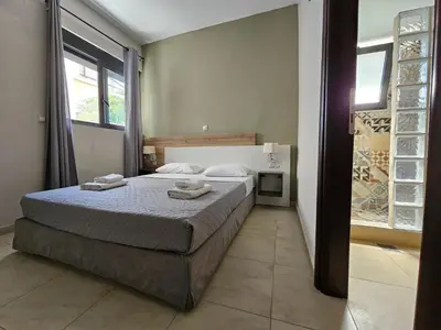 a bedroom with a bed with two towels on it at Anastazia Apartments - Rhodes City in Rhodes Town