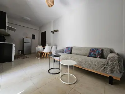 a living room with a couch and a table at Anastazia Apartments - Rhodes City in Rhodes Town