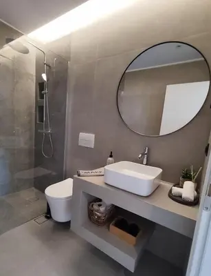 a bathroom with a sink and a mirror at Aelios Petra sea view apartment 3 in Asgourou