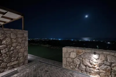 a view of the moon from the house at night at Aelios Petra sea view apartment 3 in Asgourou