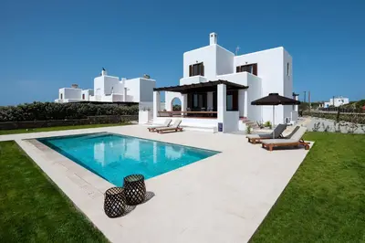 a villa with a swimming pool in front of a house at Villa Salamina in Lachania