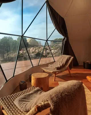 a room with a tent with a chair and a table at Dawn To Dusk Sea and Mountain View in Kamiros