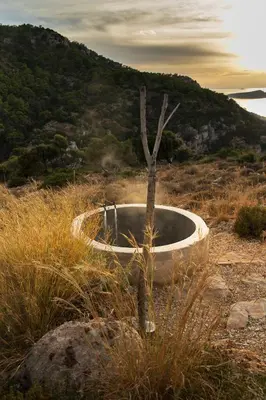 a bath tub in a field with a tree in it at Dawn To Dusk Sea and Mountain View in Kamiros