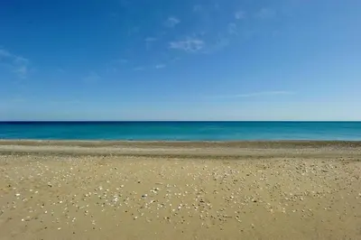 a sandy beach with the ocean in the background at The Rhodes South Escape Beach in Plimmiri