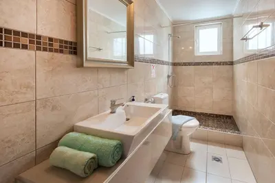 a bathroom with a sink and a toilet at The Rhodes South Escape Beach in Plimmiri