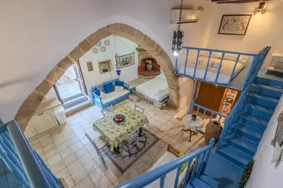 an overhead view of a living room with a table at Maison Lemonia in Lardos