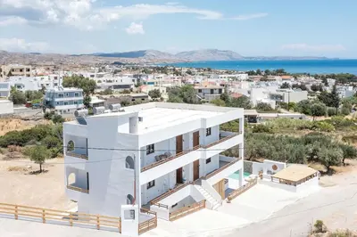 an image of a white house with a view of a city at Zàia Suites & Living, Suite N2, pool view in Gennadi