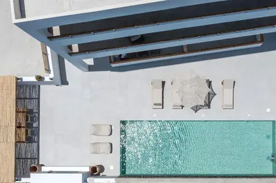 a bathroom with a swimming pool on a wall at Zàia Suites & Living, Suite N2, pool view in Gennadi