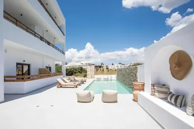 an image of a villa with a swimming pool at Zàia Suites & Living, Suite N2, pool view in Gennadi
